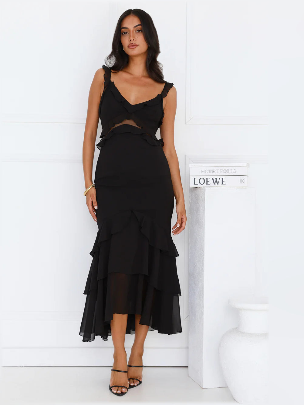 Black midi formal dress with V-neckline, fitted bodice, and tiered ruffle skirt
