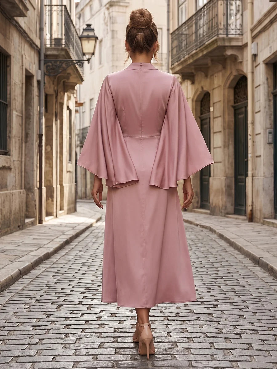 Dusty pink satin midi sheath dress with draped back and wide cape sleeves