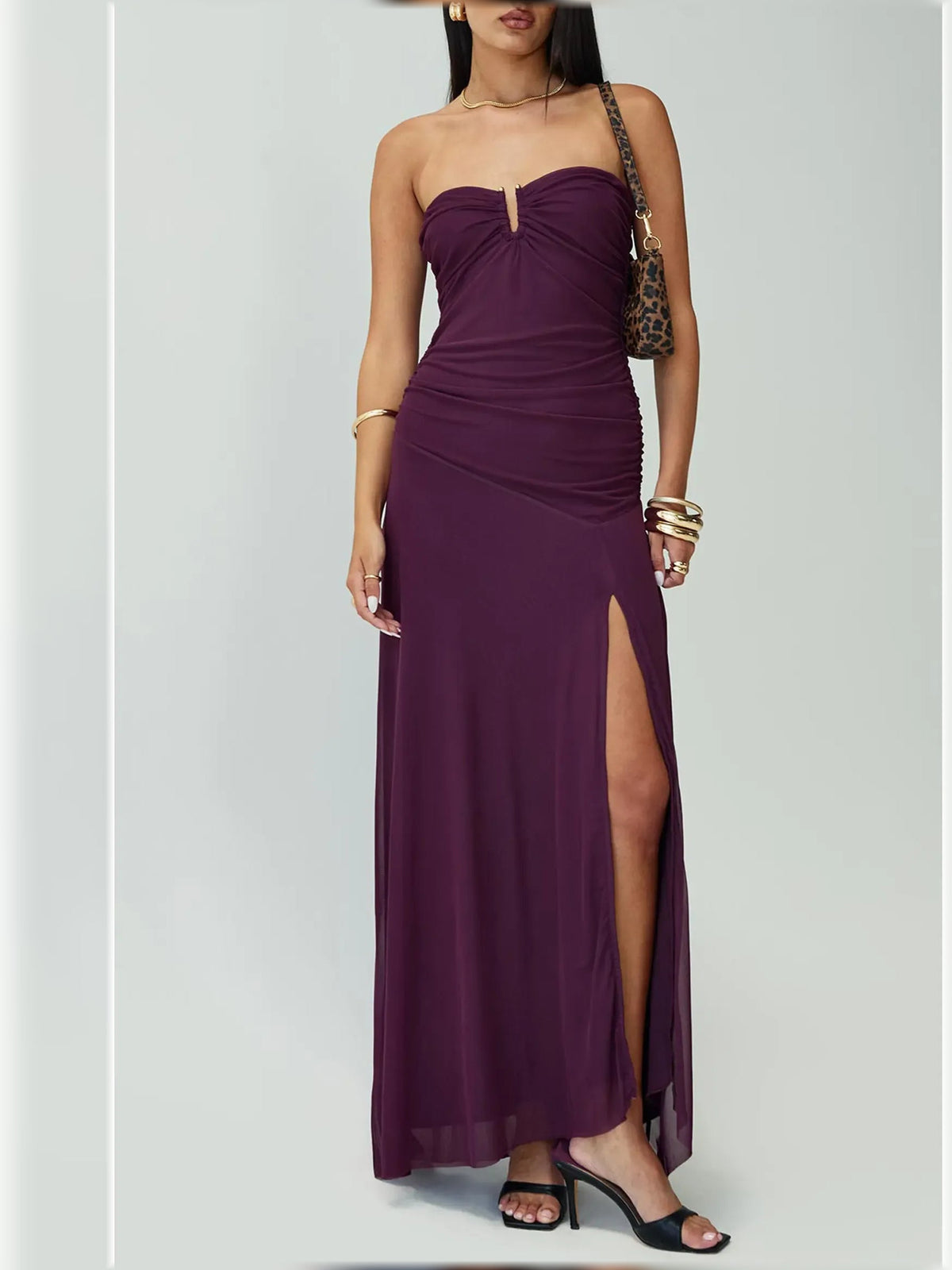 Purple strapless ruched formal maxi dress with thigh-high slit and draped side panel