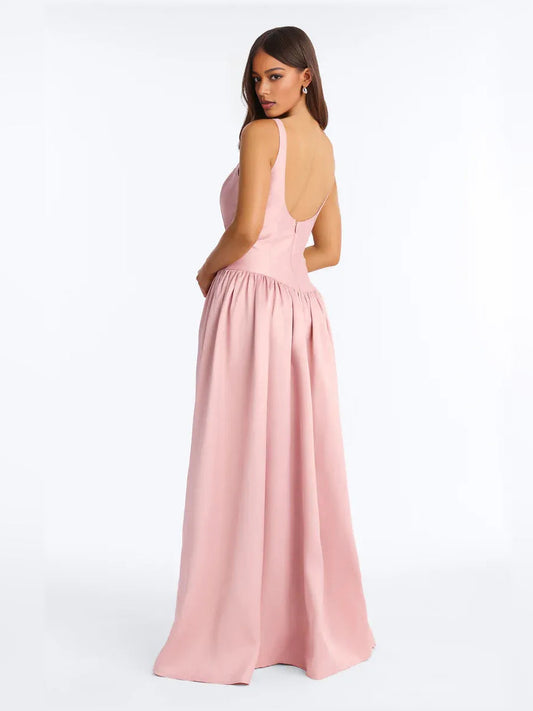 Pink V-back corset formal dress with ruched bodice and flowing floor-length skirt