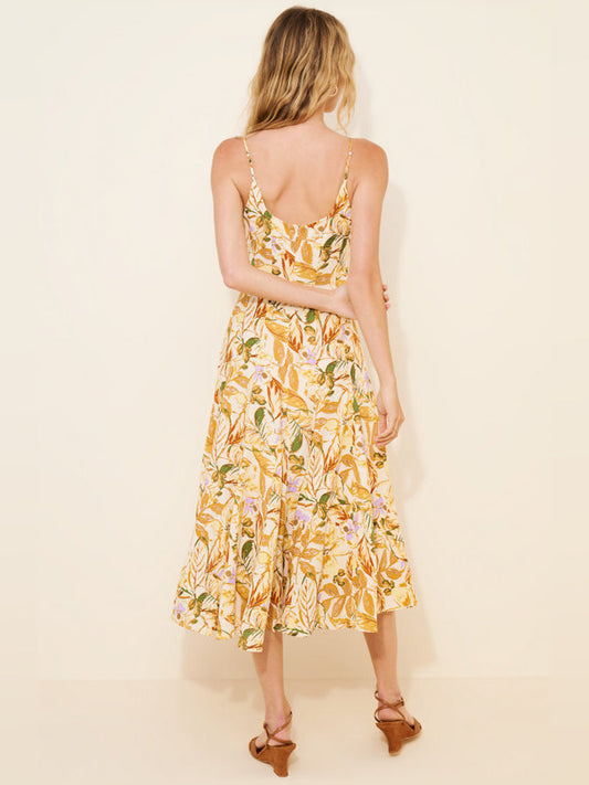 Orange floral midi dress with open scoop back, spaghetti straps, and tiered skirt