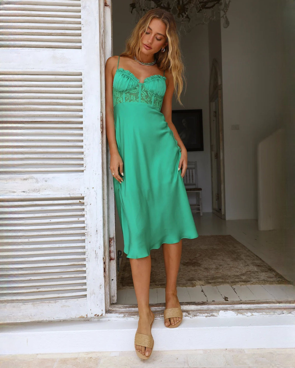 Mint green sleeveless satin midi dress with ruched neckline and draped asymmetrical hem