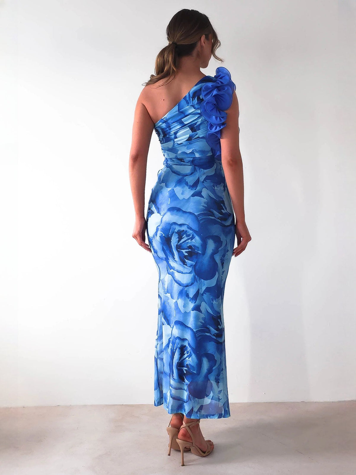 Blue sheath maxi formal dress with floral print, full-length back view