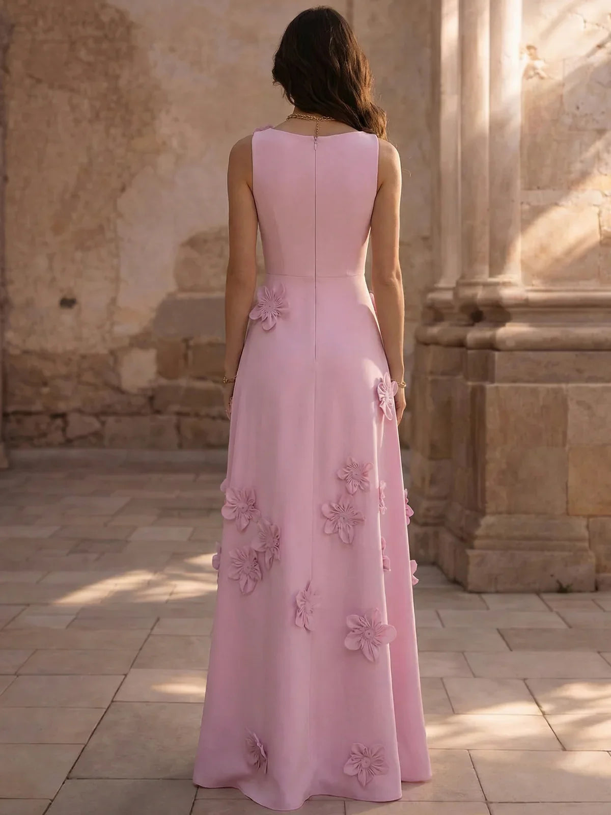 Pink A-line floor-length formal dress with floral appliqués, back view