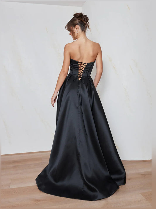 Black corset-style formal dress, lace-up open back, full floor-length satin skirt