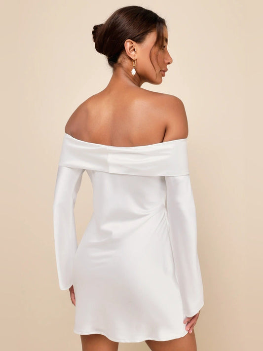 White satin mini dress off-shoulder style with long sleeves and draped back neckline