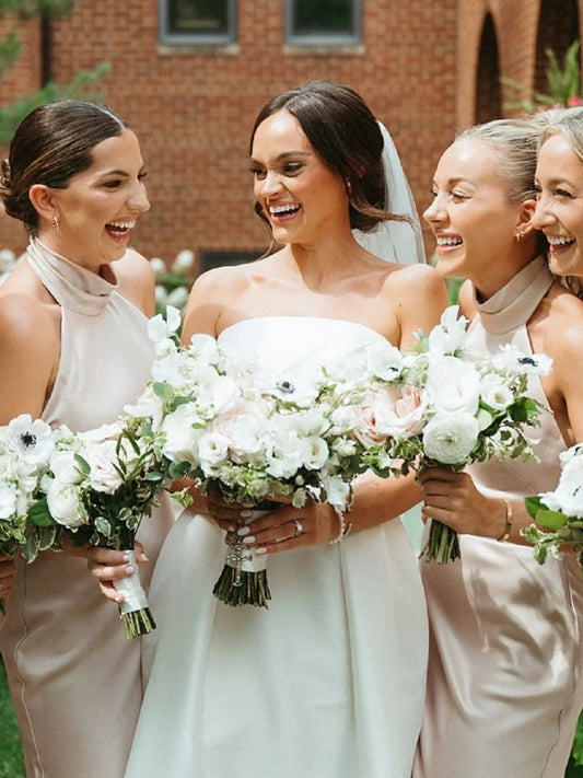 Champagne satin bridesmaid dress with off-shoulder look, high neckline, and floral bouquet