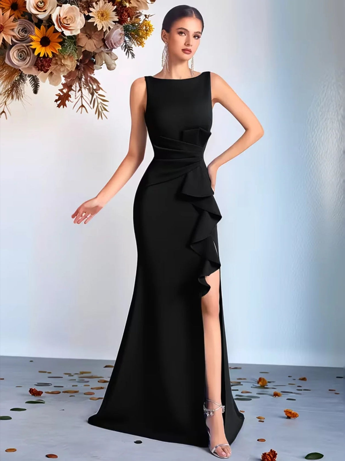 Floor-length black sleeveless prom dress with round neck, peplum ruffles, thigh slit