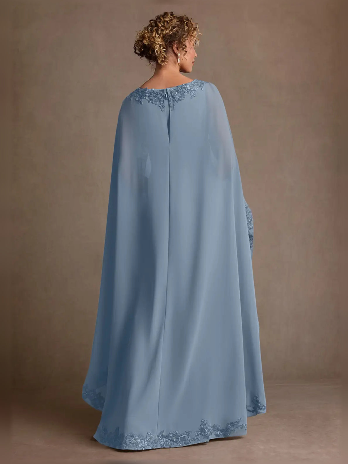 Dusty blue chiffon maxi dress, back view, with lace-embroidered sheer cape sleeves