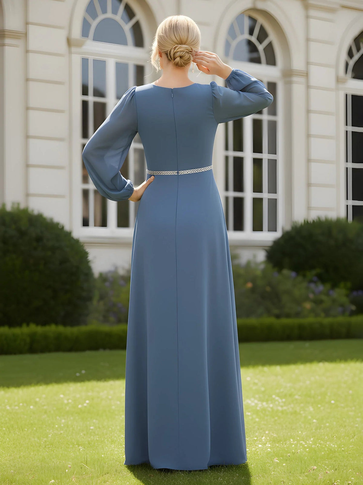 Back view of slate blue long-sleeve A-line dress with beaded waistband detail