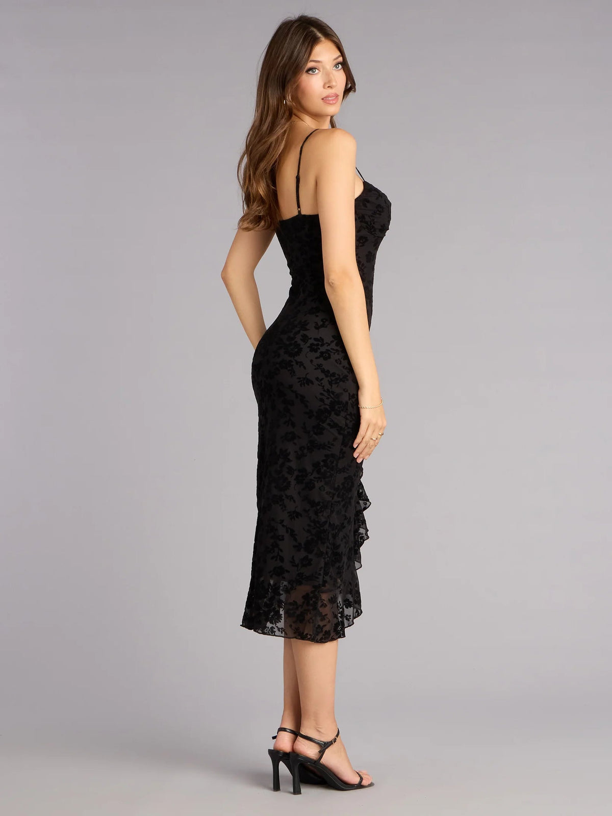 Black sweetheart ruffle midi dress with spaghetti straps and side slit, side view