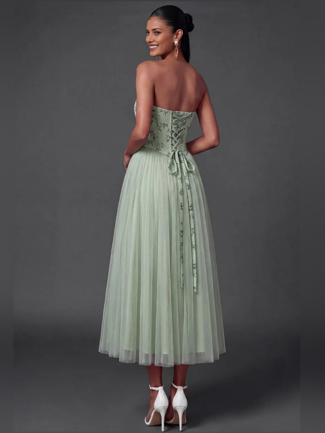 Dusty sage strapless A-line tulle dress with corset bodice, back view