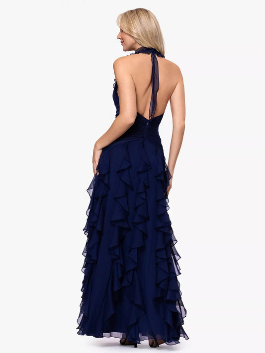 Navy halter formal dress with open back and tiered ruffle skirt to the floor