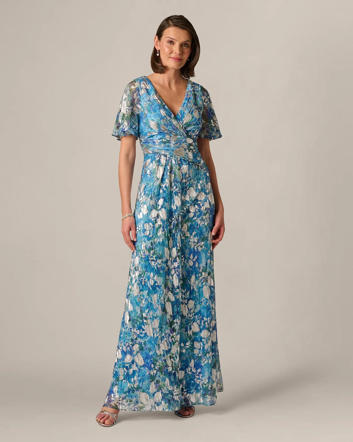Blue floral print maxi dress with wrap V-neck and flutter sleeves, side view