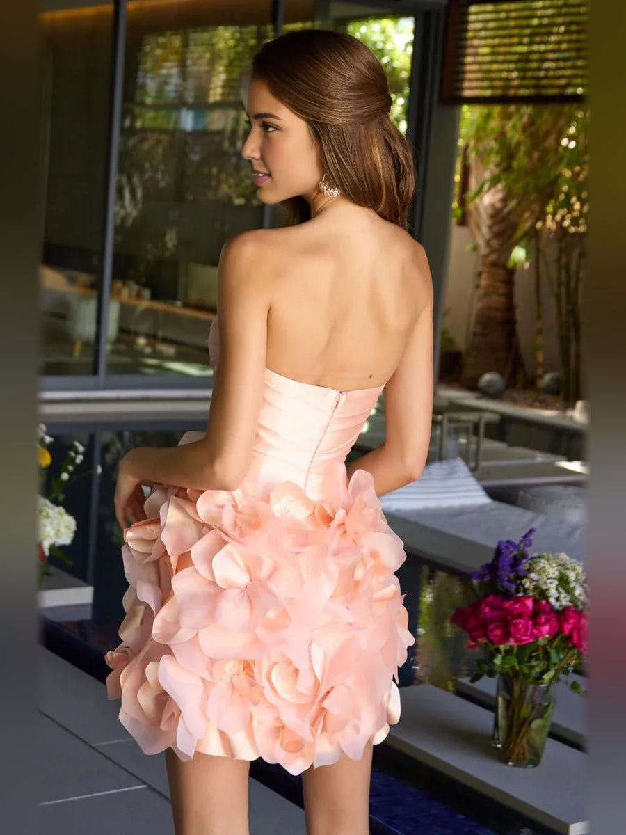 Blush pink strapless satin mini dress, back view, ruched bodice with layered floral appliques
