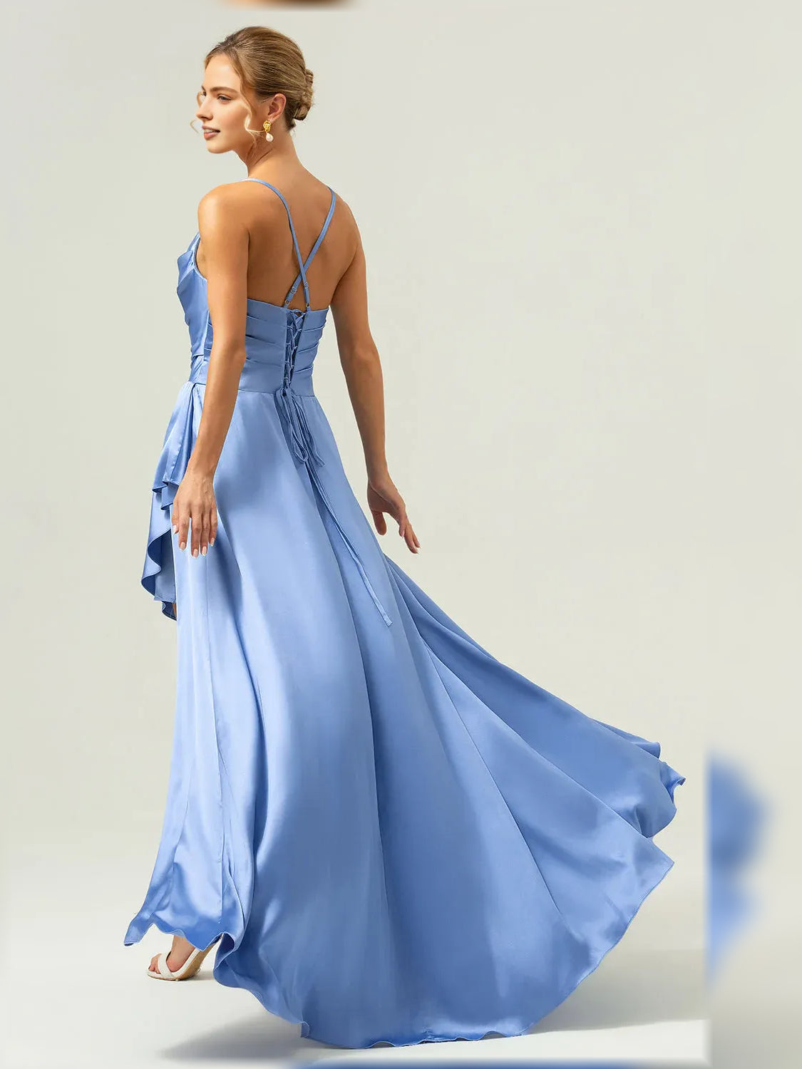 Blue formal satin maxi dress with cowl bodice, spaghetti straps, and draped ruffle hem