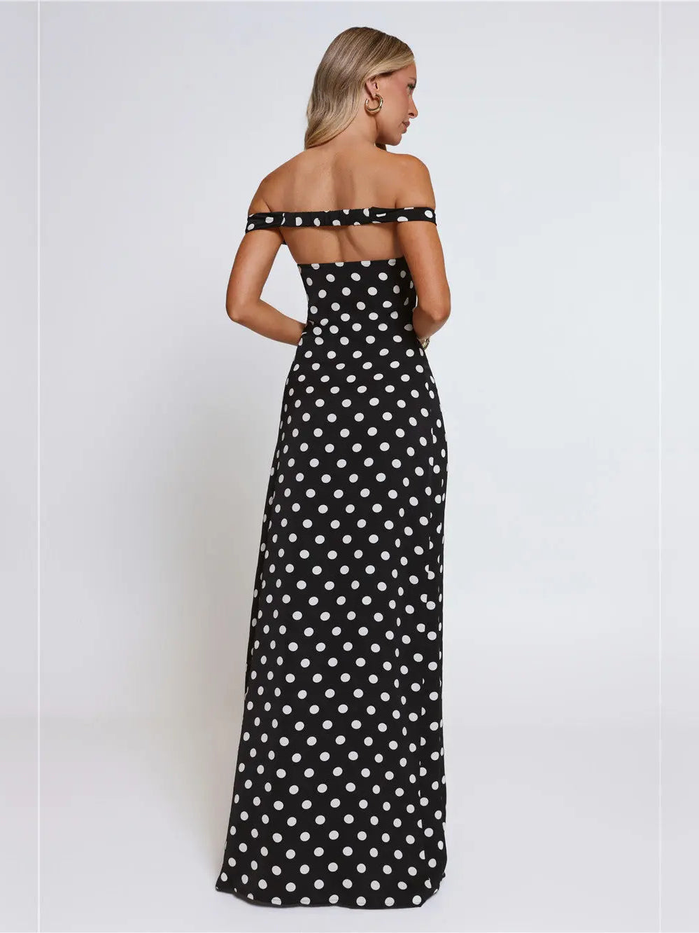 Black a-line maxi formal dress with printed pattern, full-length back view