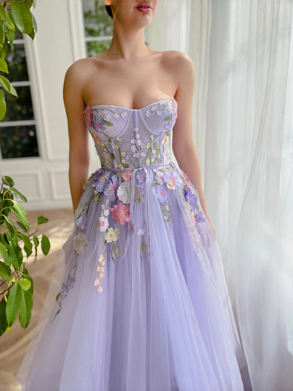 Lavender strapless corset prom dress with floral applique and gathered tulle A-line skirt