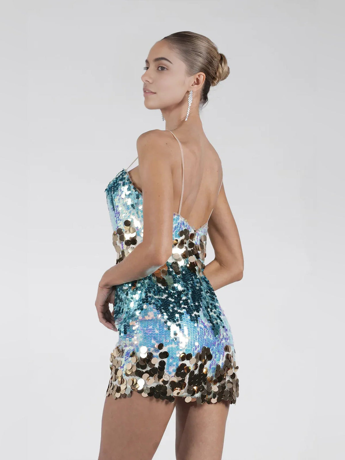 Backless turquoise sequin mini dress with spaghetti straps and all-over gold sparkle