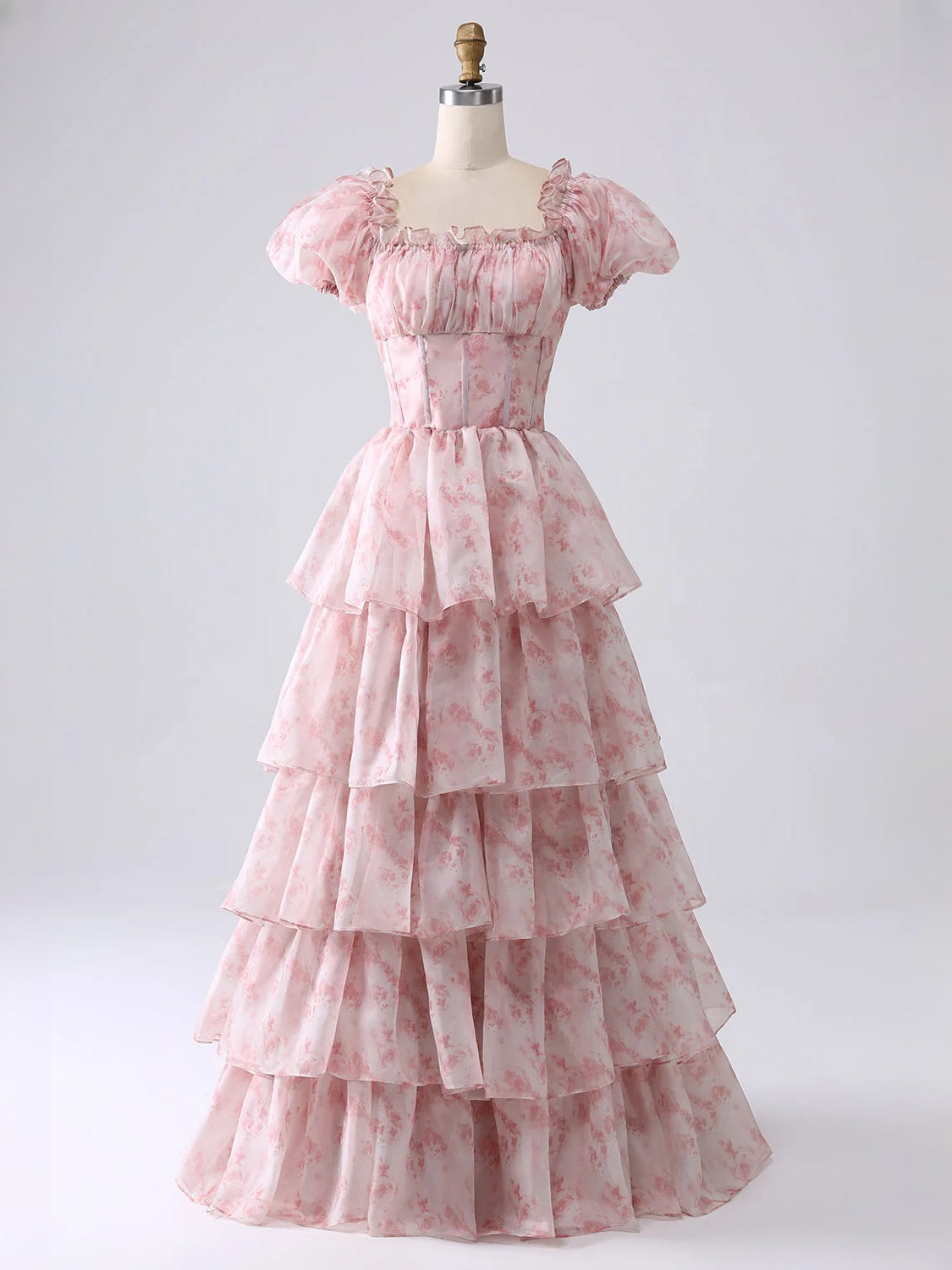 Azalea pink off-shoulder tiered corset A-line prom dress on mannequin, floor length.