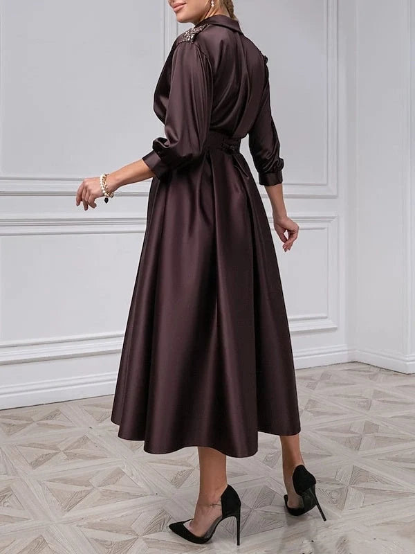 Deep purple satin midi dress, side view, V-neck with long puff sleeves and A-line skirt