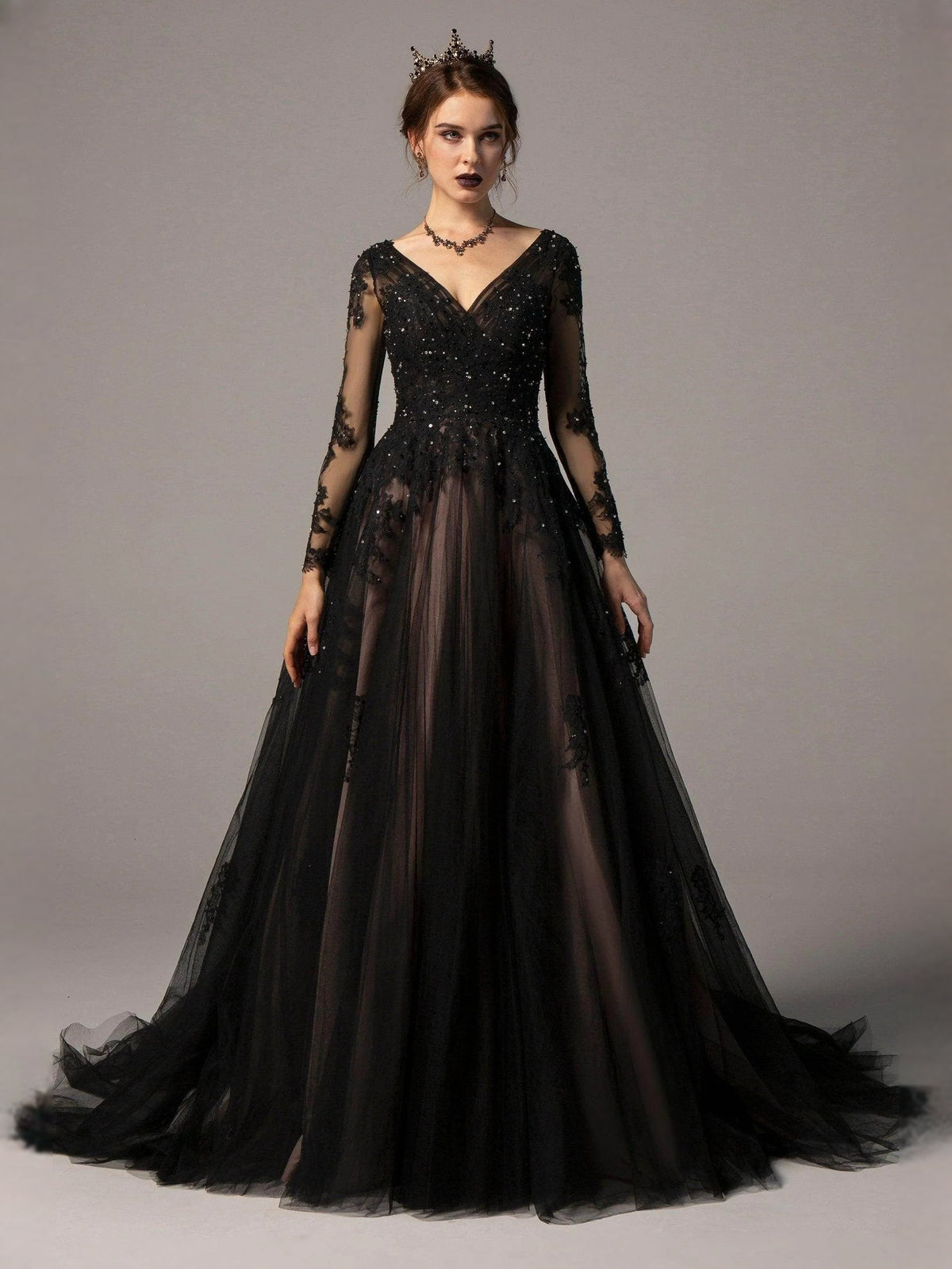 Black V-neck corset wedding dress with sparkling bodice, sheer floral sleeves, and A-line skirt