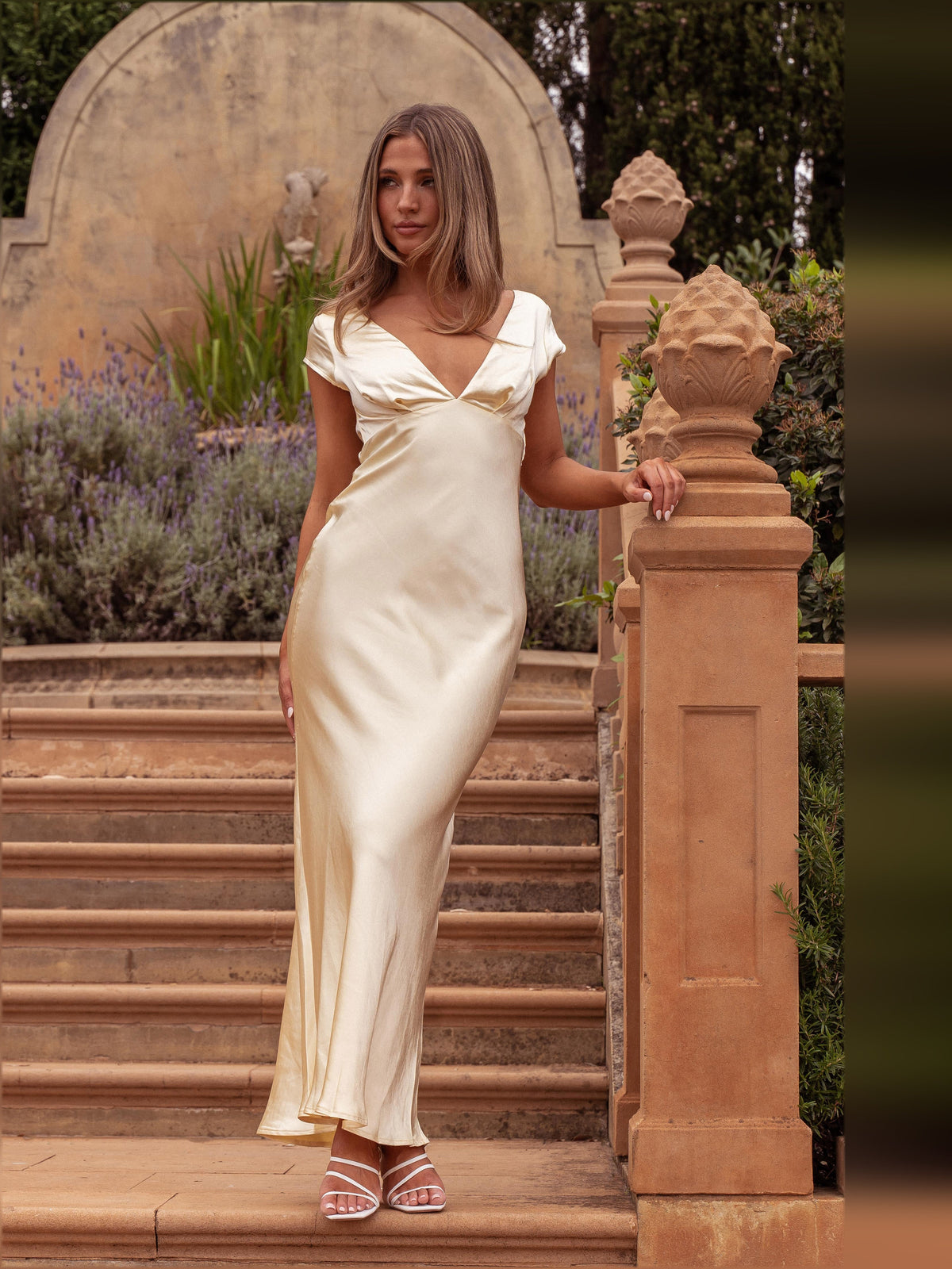 Yellow V-neck midi dress with twist-back detail, draped skirt