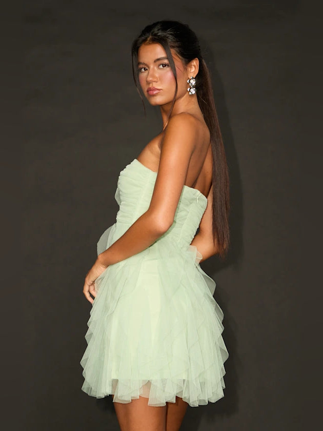 Mint green strapless mini dress with layered ruffle skirt, side view