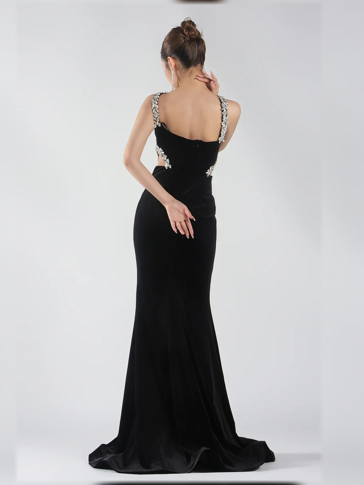 Black halter neck floor-length formal dress with open back and silver beaded strap detail