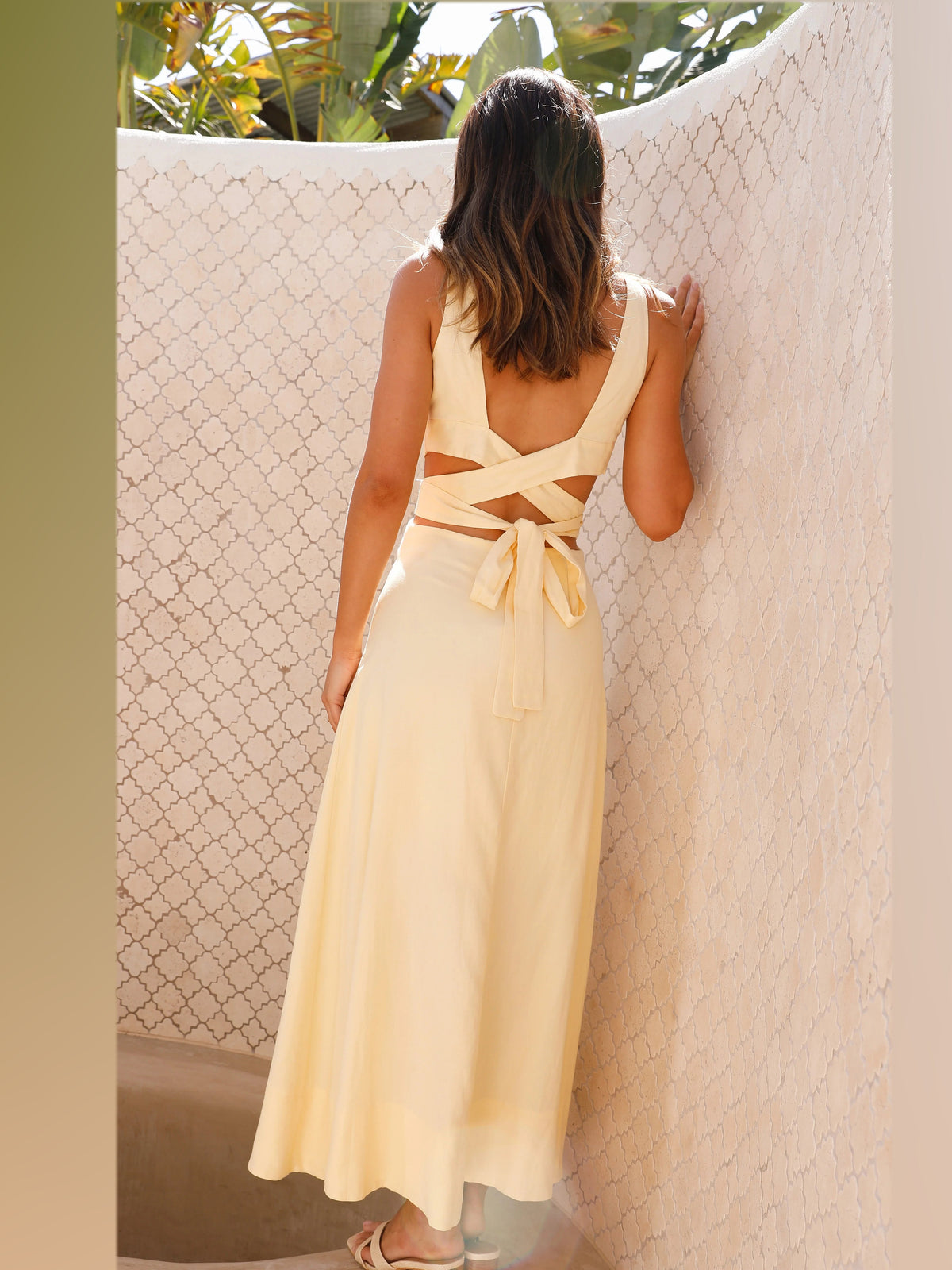 Black midi formal dress, back full-length view showing the bodice