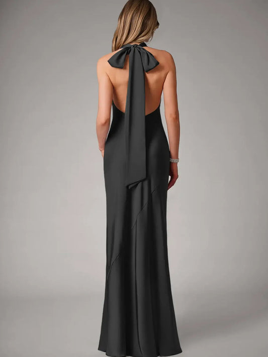 Black satin halter gown, open-back with long bow tie, floor-length