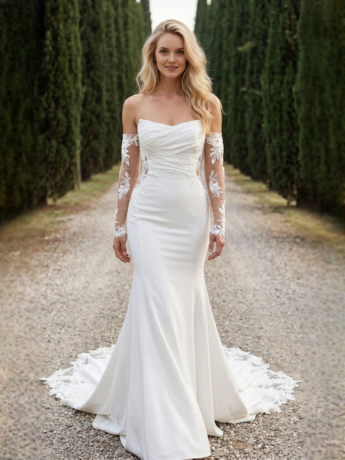 Ivory strapless mermaid wedding dress with ruched bodice and floral lace sleeves