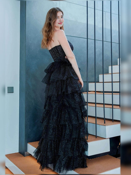 Black strapless tiered ruffle gown with sparkling bodice