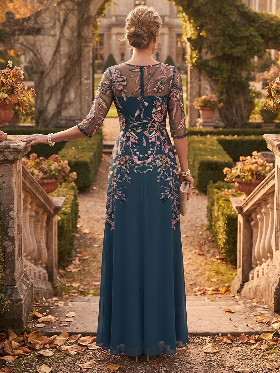 Navy embroidered floral A-line dress, back view with sheer 3/4 sleeves