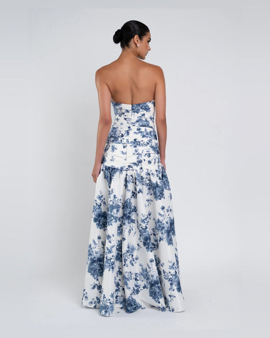 Blue strapless A-line maxi dress, back view, white floral print and tiered skirt
