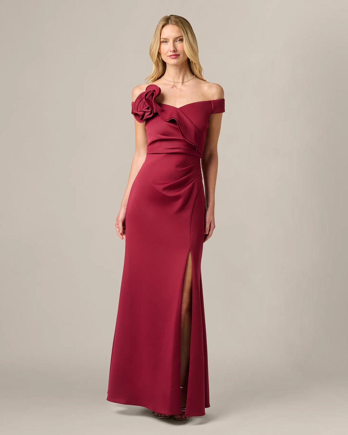 Crimson red off-shoulder mermaid maxi dress with rosette detail and center slit
