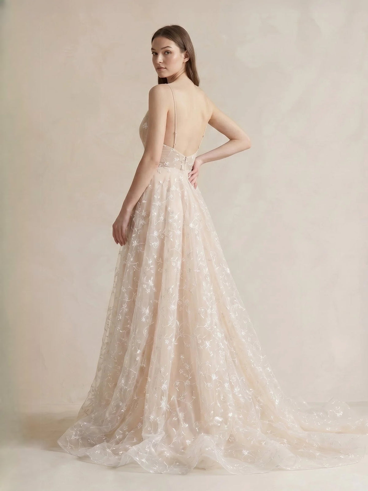 Champagne tulle A-line dress with floral pattern, V-neck front, and open back