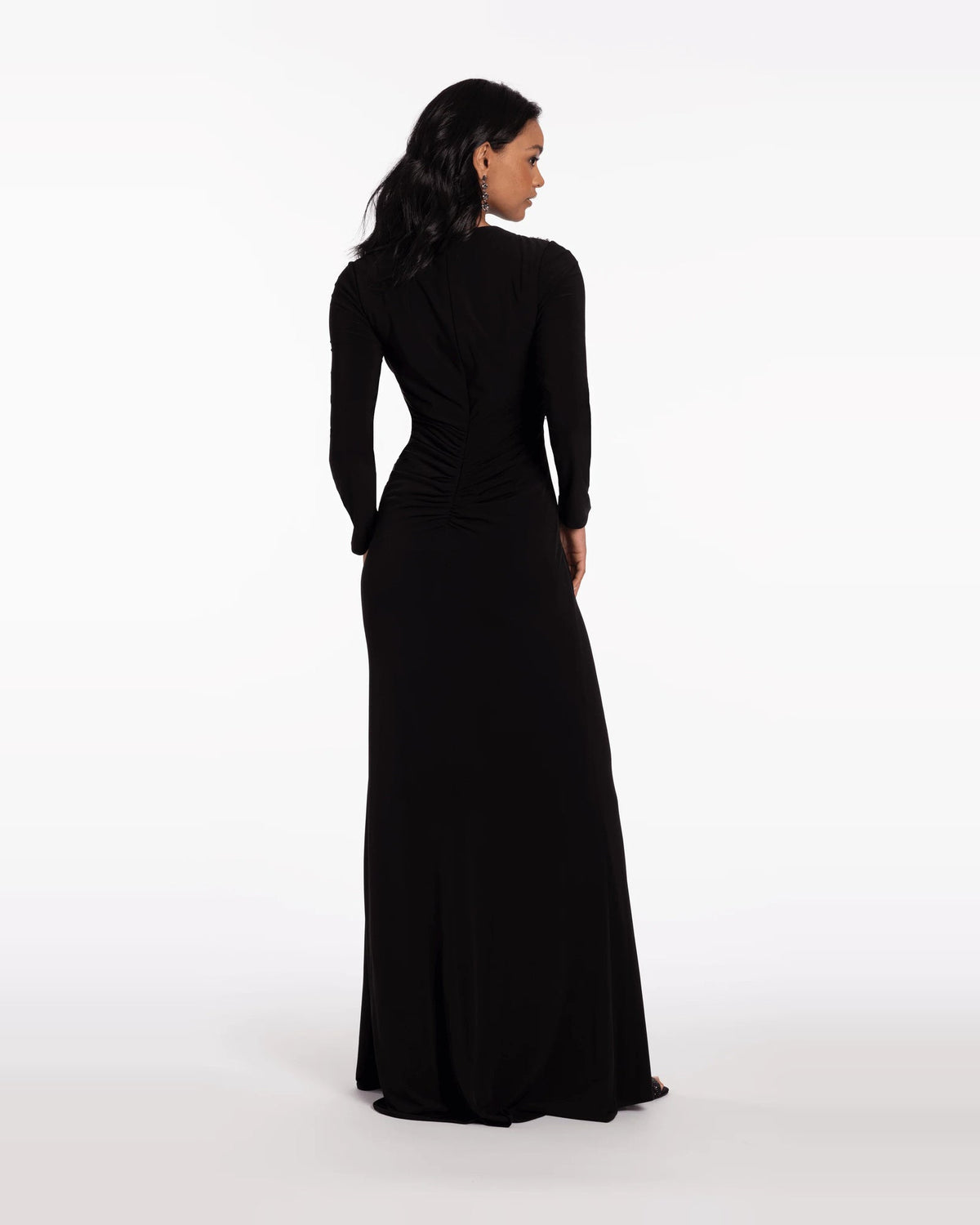 Black beaded jewel-neck column maxi prom dress from back view, long sleeves