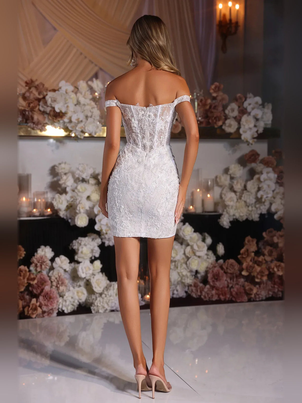 White glitter bodycon mini dress from back view with off-shoulder corset bodice