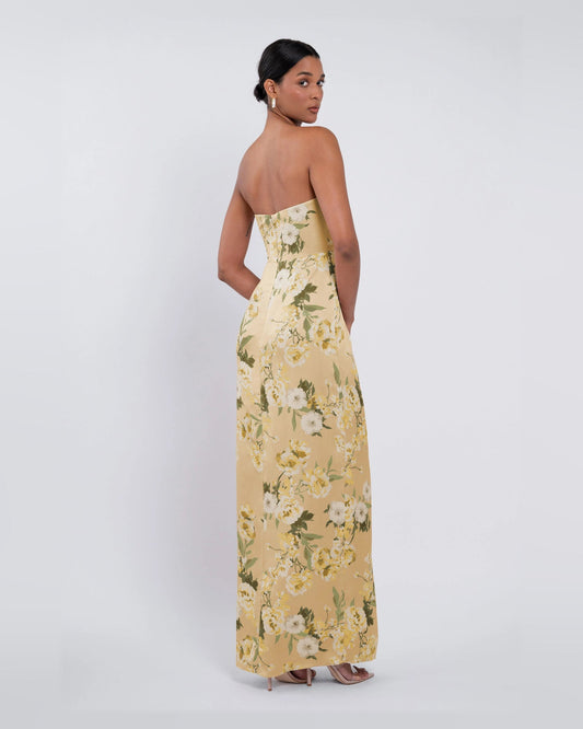 Yellow floral strapless A-line maxi dress with thigh-high slit, side view