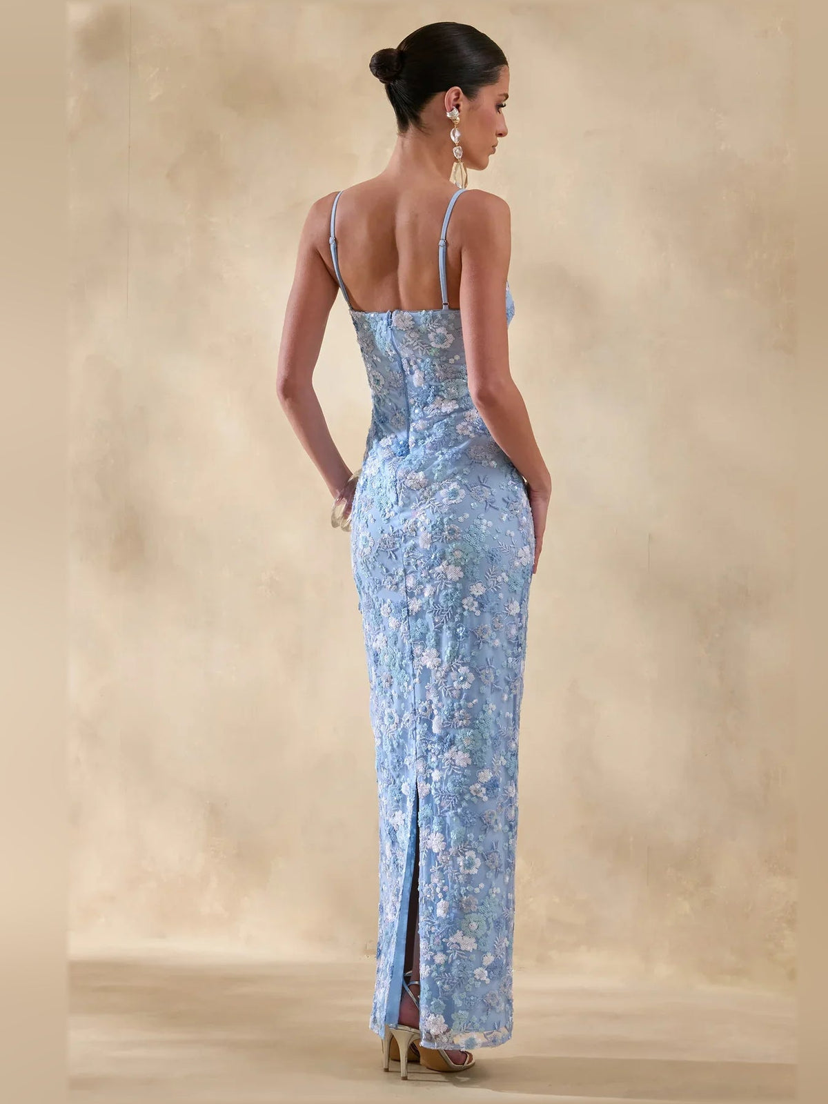 Blue floral print formal dress with spaghetti straps, open-back style, side slit