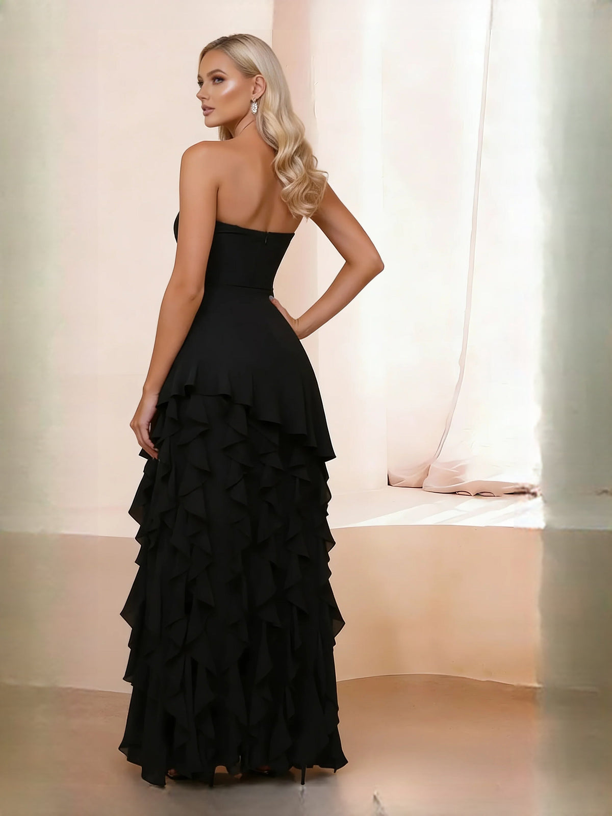 Black strapless maxi dress with tiered ruffle skirt and sweetheart bodice