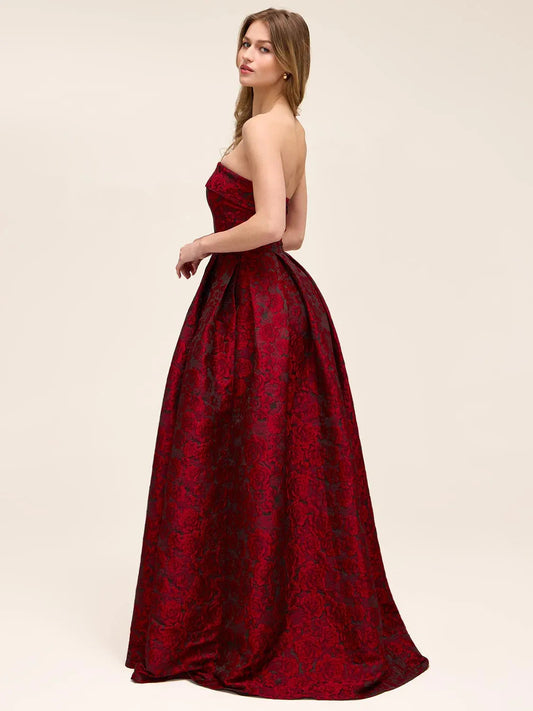 Deep red floral print strapless formal dress, side view with front slit, floor-length