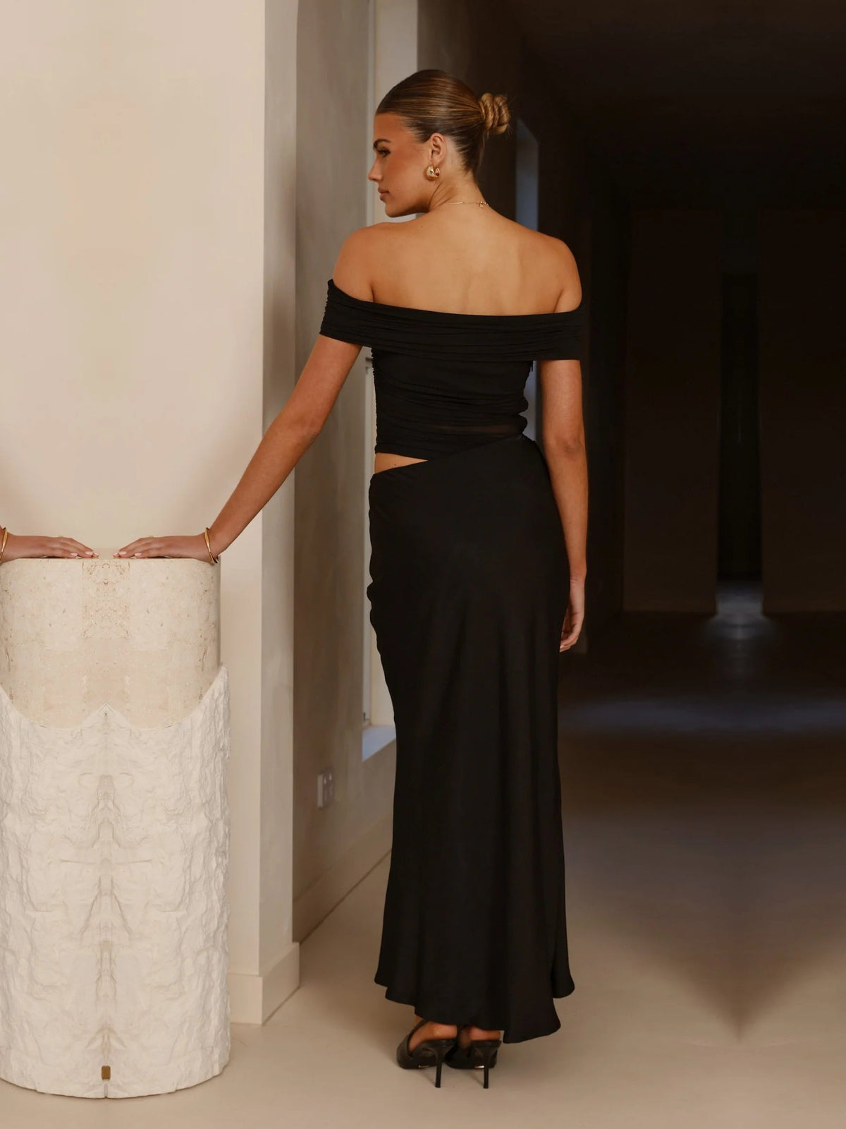 Black sheath maxi formal dress with ruching, full-length back view