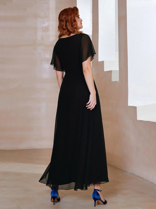Black A-line maxi chiffon dress, back view with sheer short sleeves and V-neck