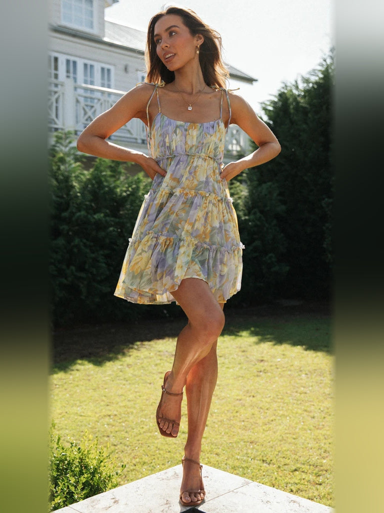 Floral tiered mini dress with smocked bodice, spaghetti straps, and layered skirt