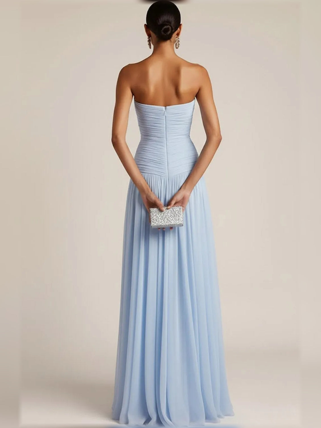 Backless-look strapless light blue ruched bodice with pleated floor-length skirt