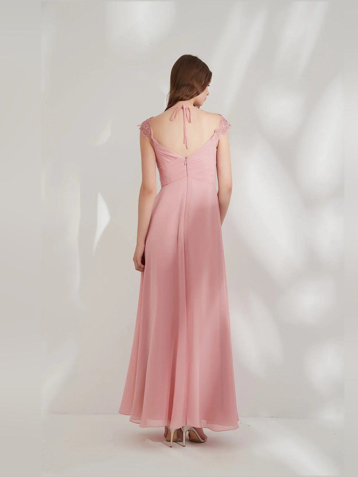 Pink chiffon maxi dress with open back tied straps and ruffled cap sleeves