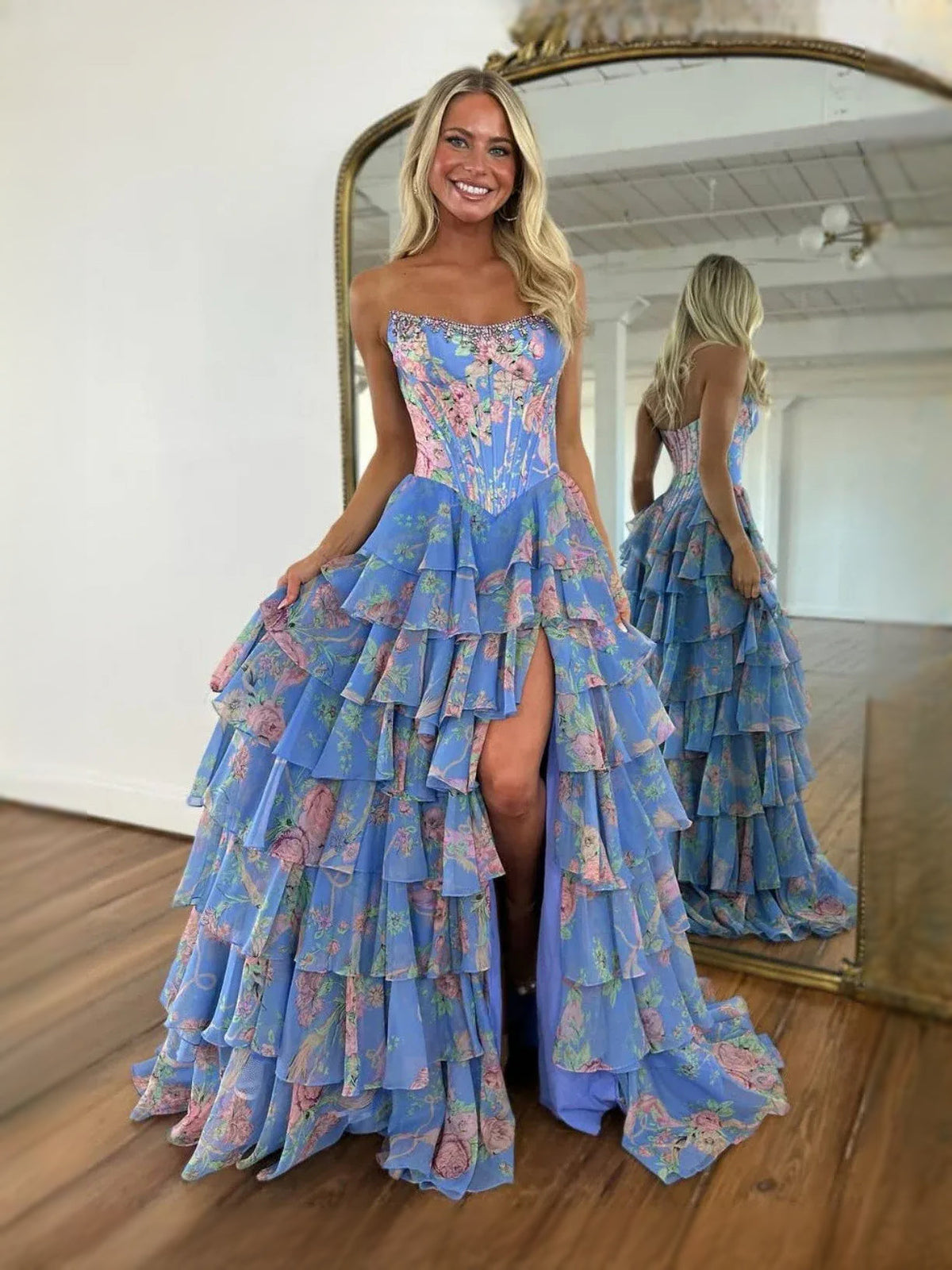 Blue floral corset-style sweetheart A-line prom dress with tiered ruffles and side slit