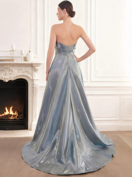 Dusty blue satin formal dress with strapless open back and pleated A-line skirt